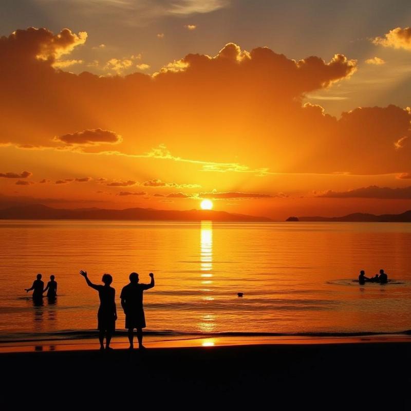 Nagoa Beach at sunset with people enjoying the beach activities