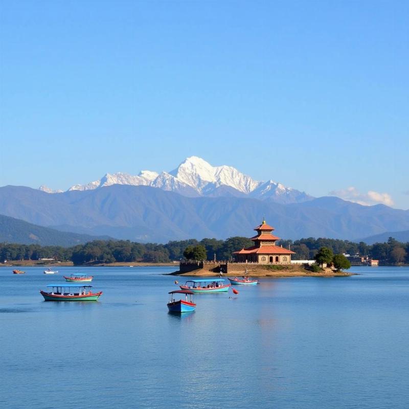 Colorful boats on Phewa Lake, with the Annapurna range in the background.