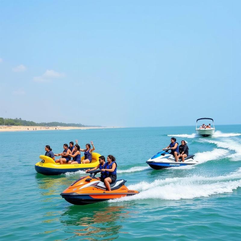 Tourists enjoying water sports at Mandarmani Beach