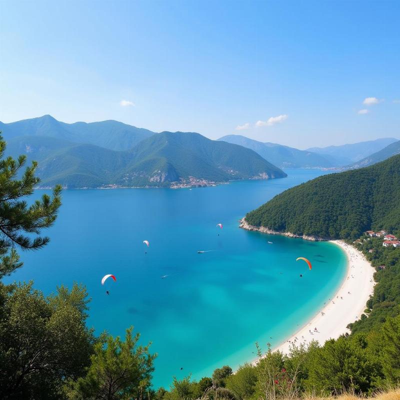 Ölüdeniz Beach's tranquil blue lagoon and paragliders soaring above.